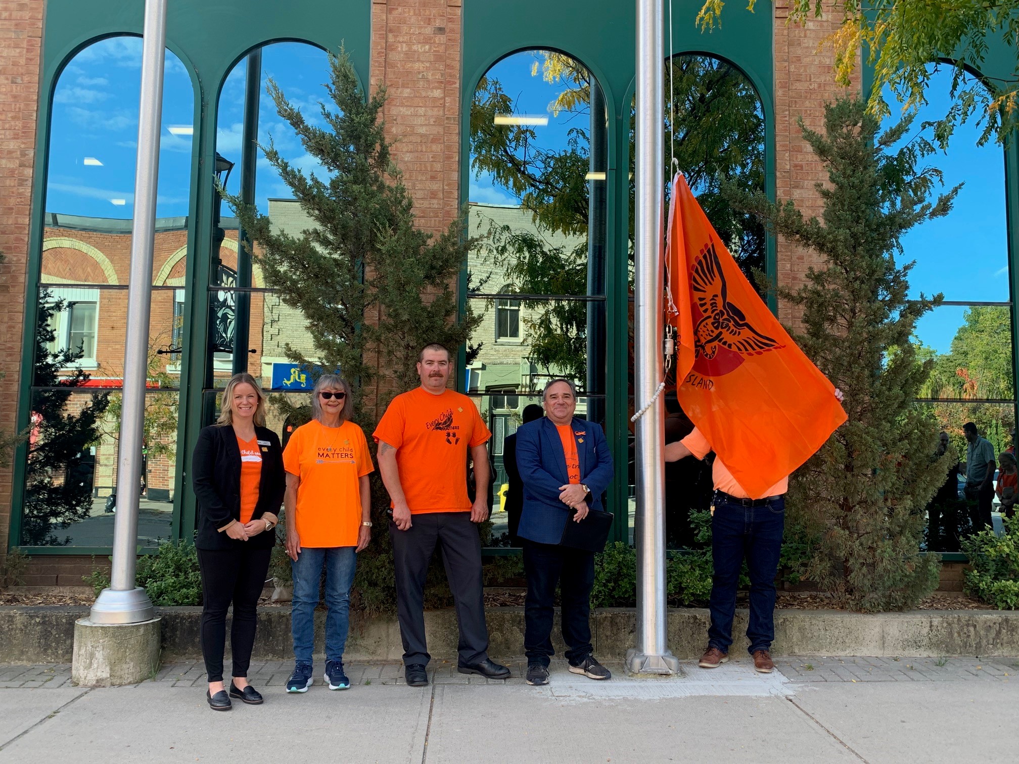 Councillor Doble, Councillor Campbell, Regional Councillor Jubb and Mayor Schummer outside of the Cannington office with the Indigenous  and Canadian Flags at half mast