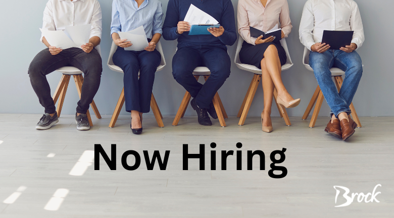 5 people sitting on chairs with resumes in their hand. txt reads now hiring