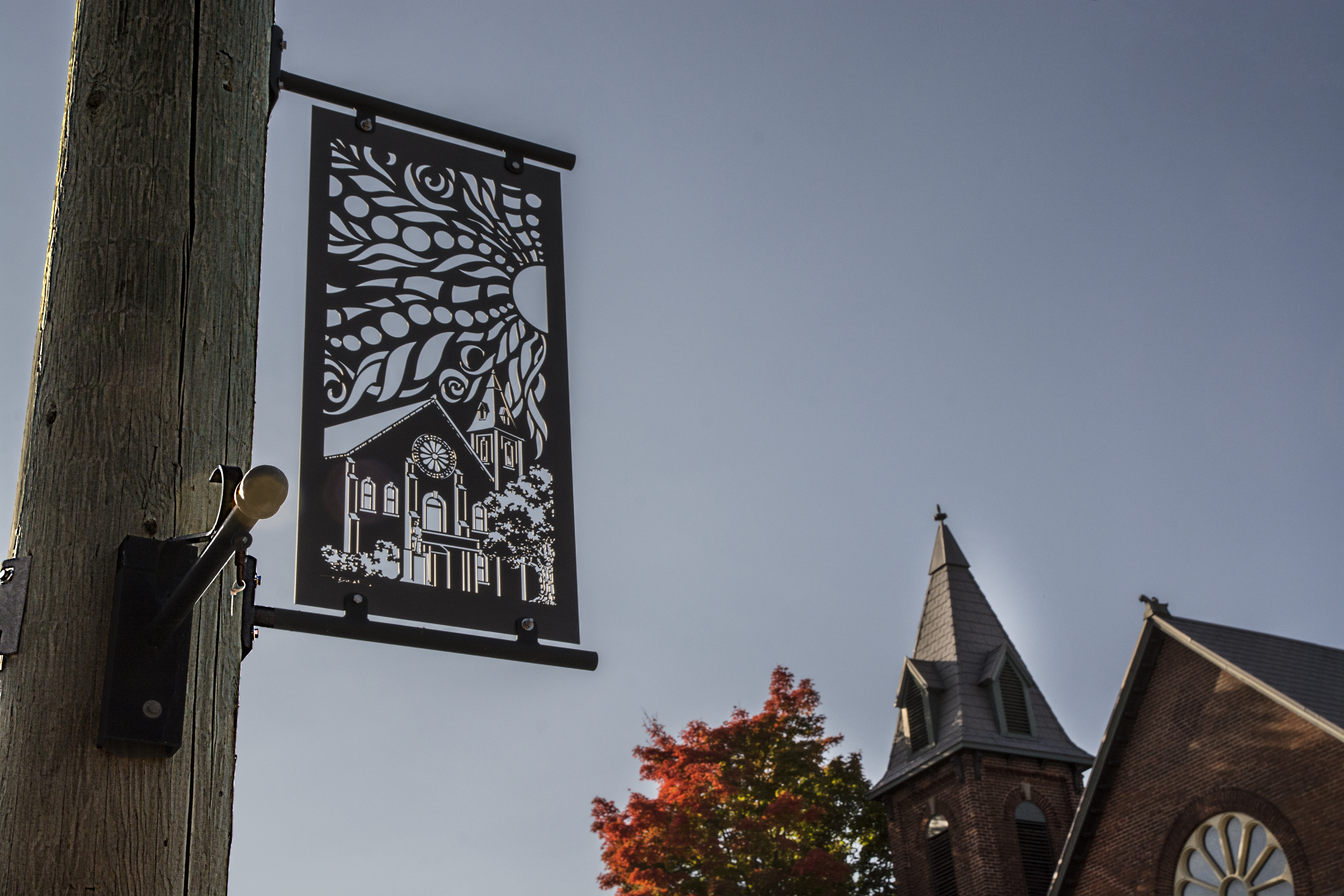 Artistic metal banner on a post