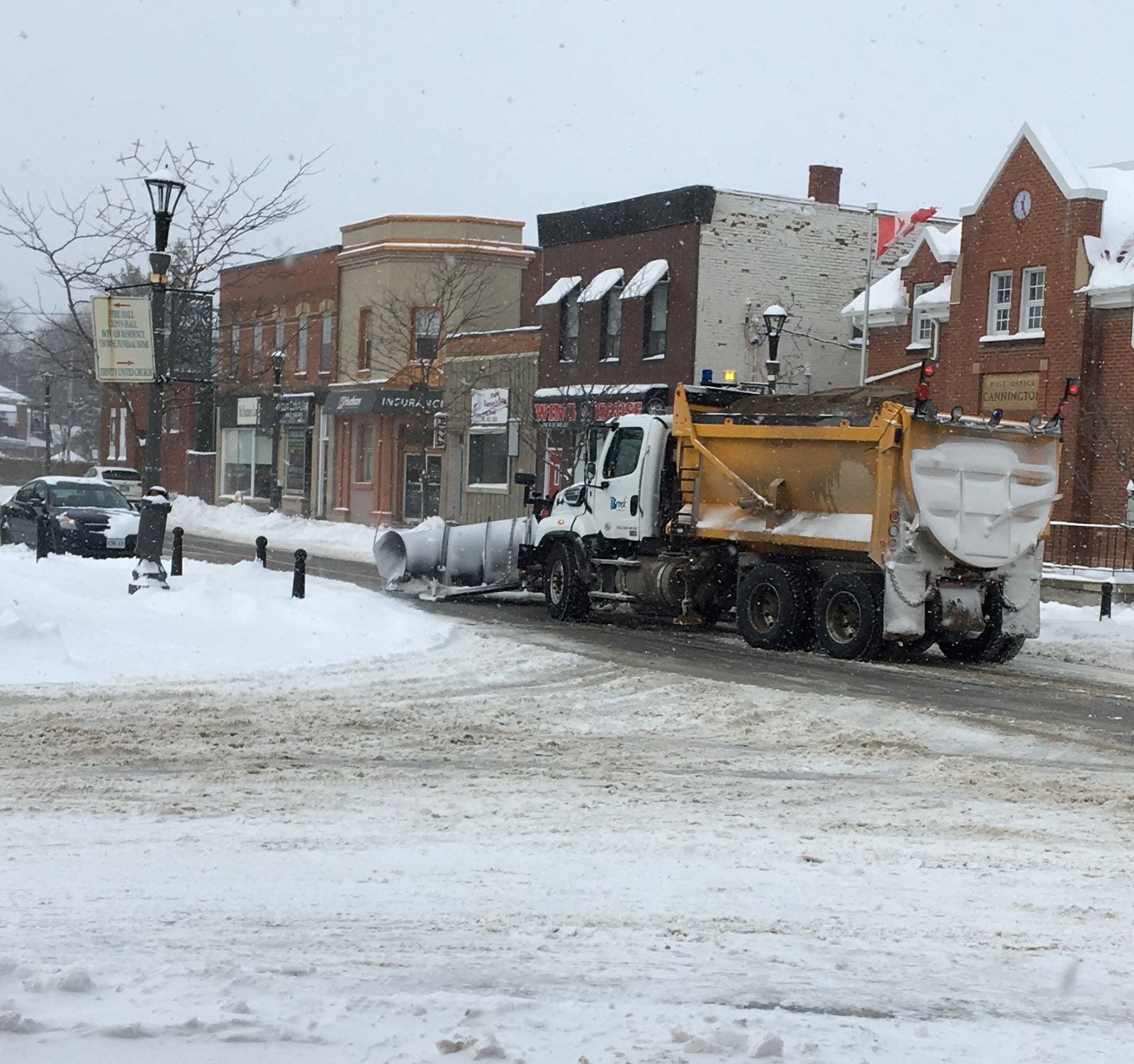 Township of Brock Snowplow clearing the main Street of Cannington