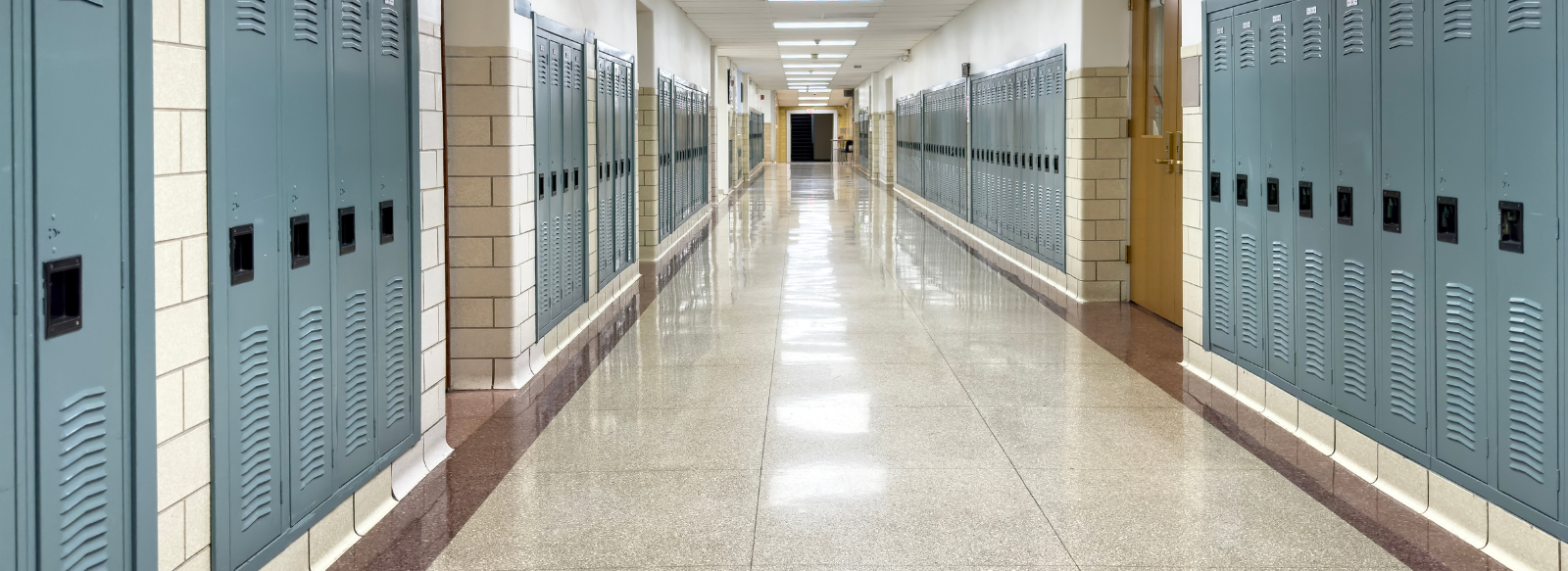 long hallway with blue lockers on both sides